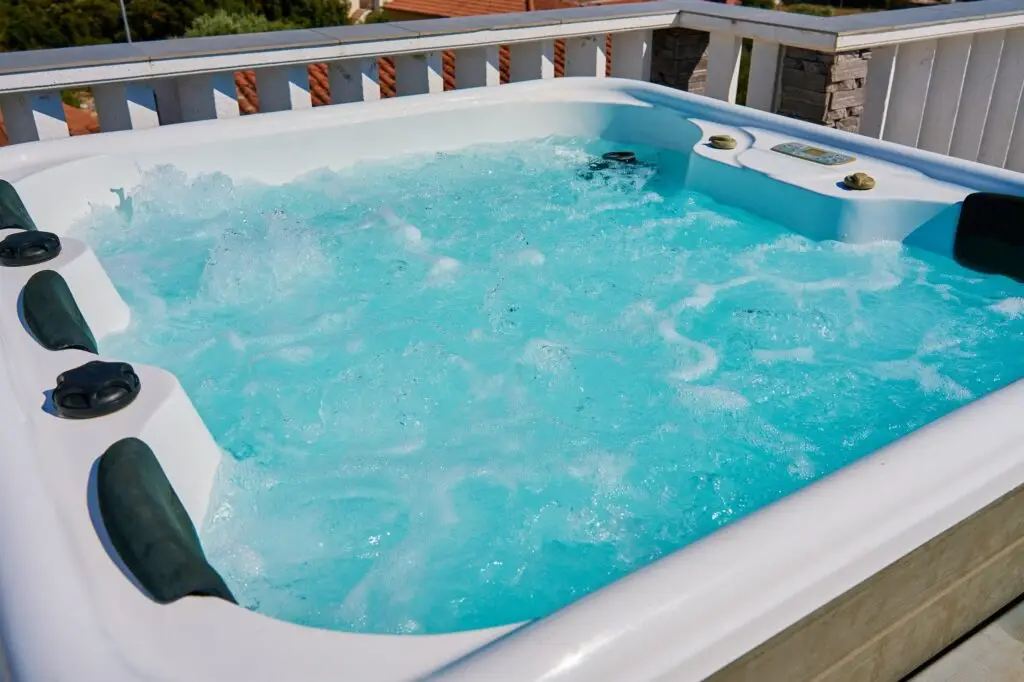 Close-up shot bubbling water in hot tub with headrests